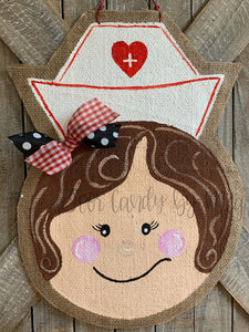 nurse door hanger with nurse hat and red and black bow