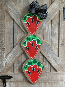 red and green watermelon slice door hanger with black bow