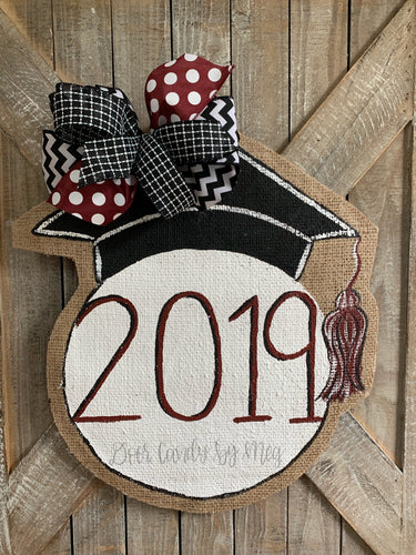 graduation cap door hanger with maroon and black bow