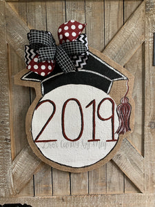 graduation cap door hanger with maroon and black bow
