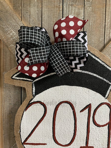 graduation cap door hanger with maroon and black bow