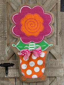 pink and orange whimsical burlap flower door hanger in orange and white polka dot flowerpot