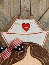 Load image into Gallery viewer, nurse door hanger with nurse hat and red and black bow