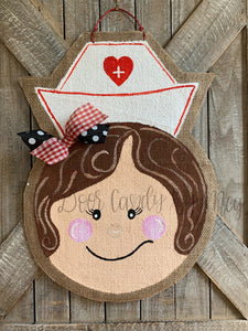 nurse door hanger with nurse hat and red and black bow