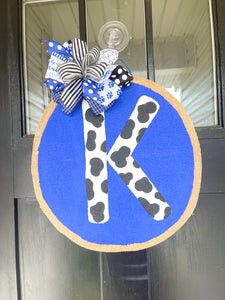 Big Blue Circle with Cow Print K Door Hanger