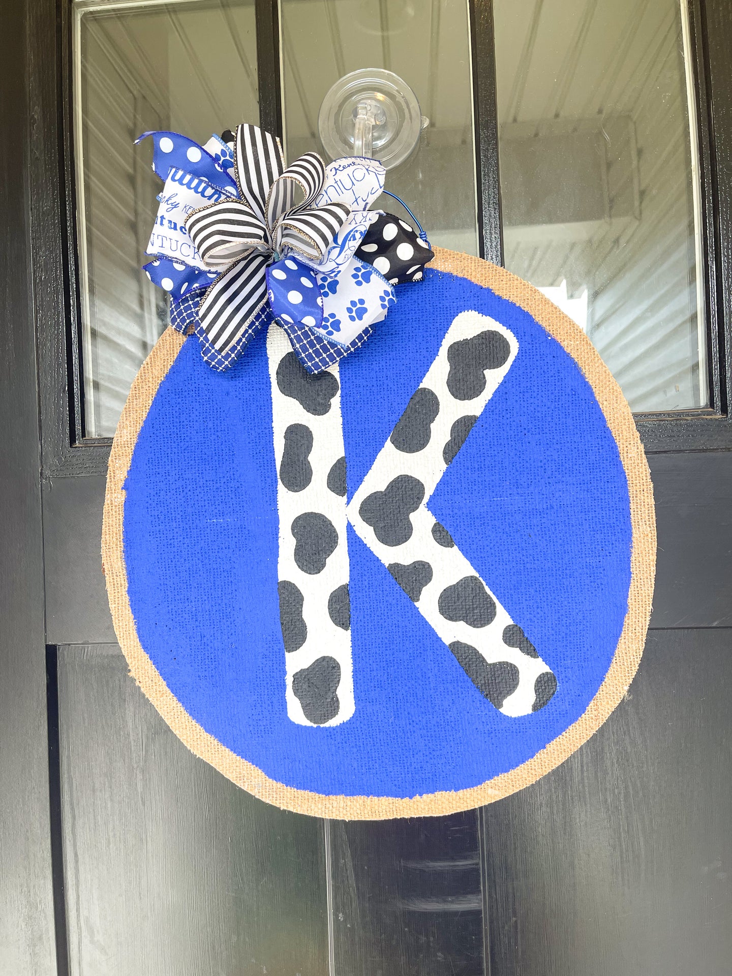 Big Blue Circle with Cow Print K Door Hanger
